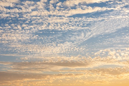 Cirrocumulus clouds sunset sky light cloudscape background patternの写真素材