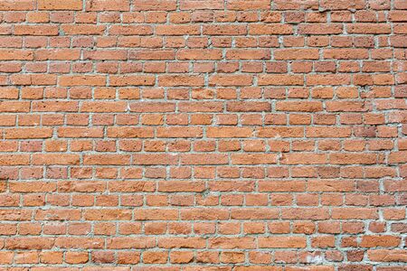 Old damaged worn brick wall texture backgroundの写真素材