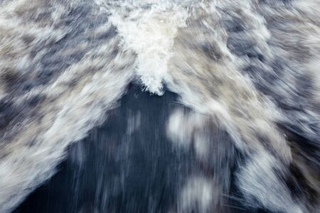 Fast moving water boat trail long exposure abstract viewの写真素材