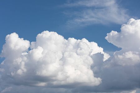 Fluffy cloud edge and blue sky cloudscape backgroundの写真素材