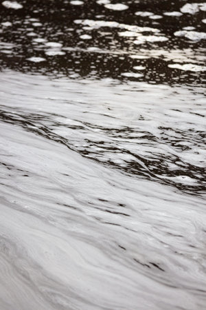 White foam in water surface at river