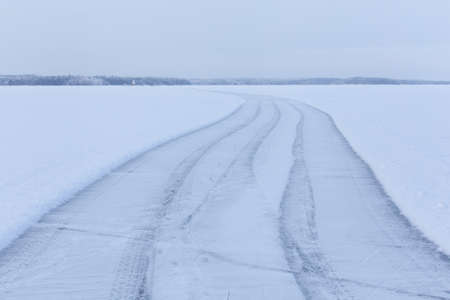 Empty ice skating track at the frozen lakeの写真素材