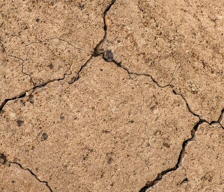 Old concrete cement with cracks and natural destruction from time and weather conditionsの写真素材