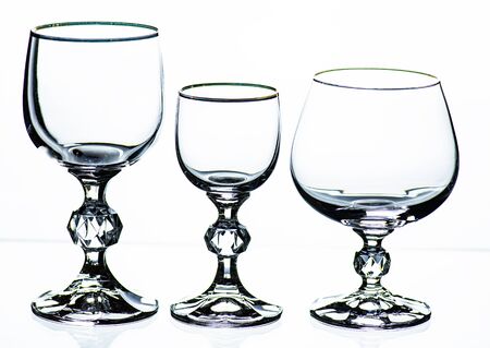 Beautiful Contour silhouette glass for vodka, cognac and wine. On white backgroundの写真素材