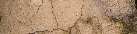 Old concrete cement with cracks and natural destruction from time and weather conditions