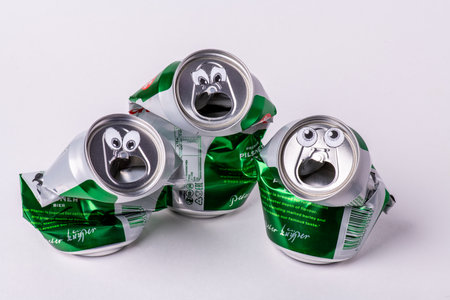 Tatarstan, Russia - Dec 08th 2020. Beer installation Grolsch aluminum drink can sing karaoke song in the choir. Beer can or soft drink on white background.のeditorial素材