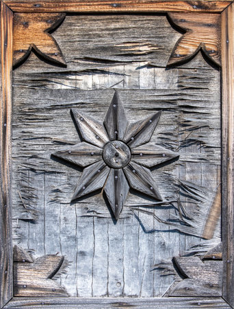 Old Window shutters of an old Russian house. Faded in the sun and destroyed by active weather.の写真素材