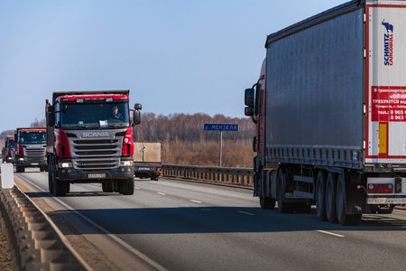 Tatarstan, Russia, Interstate Highway M7 - Apr 14th 2021. Several SCANIA Trucks move along the...