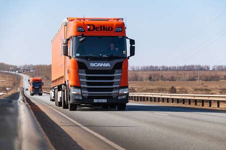 Tatarstan, Russia, Interstate Highway M7 - Apr 14th 2021. Several DELKO company truck move along the federal highway to their destination.のeditorial素材