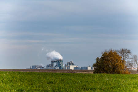 Chemical Plant factory with smoke stack. Smoke emission. Petrochemical industry with distillation column, drum and pipe in oil and gas. Ecology and environmental protection problems, air pollutionの写真素材