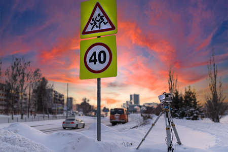 Automatic speed camera car or traffic. Road sign speed limit 40 and Caution attention to children on the road. School bus near the school. Concept for surveillance on highway, street and tool of police, control drive.の写真素材