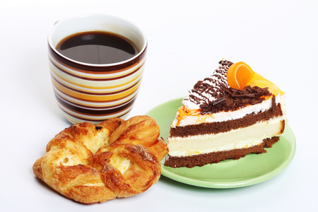 Delicious fresh baked chocolate cake with a cup of coffeeの写真素材