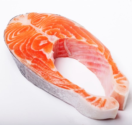 Salmon. Fresh raw salmon red fish steak.Isolated on white.の写真素材