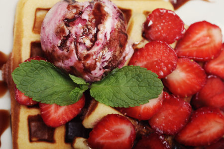 delicious waffles with strawberry and ice creamの写真素材