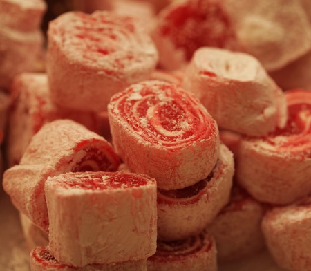 Turkish delight with pistachio nuts over plateの写真素材