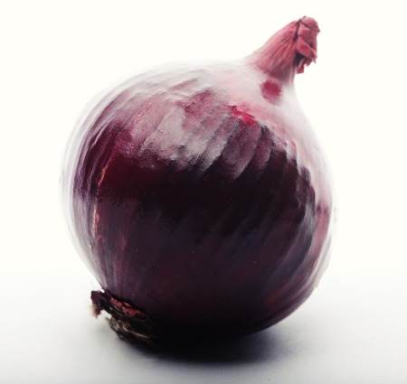 red onion over white backgroundの写真素材