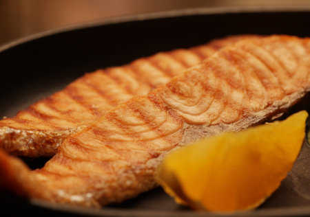 salmon steak served with spinach