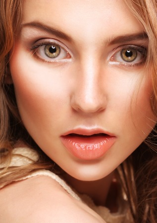 young woman with curly hairの写真素材