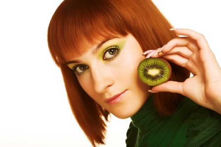 woman with kiwi on whiteの写真素材