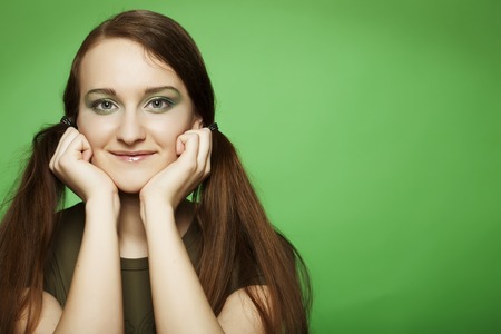 young girl on green backgroundの写真素材