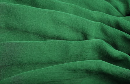 Green fabric texture background, close upの写真素材