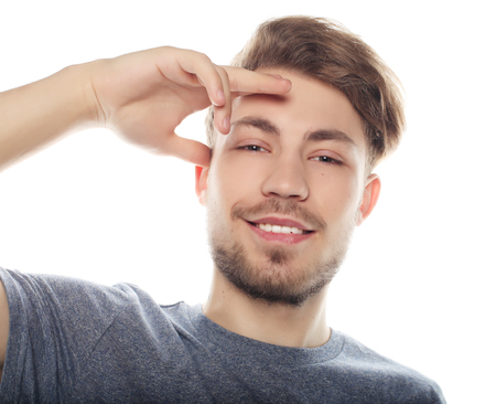 happy smiling man looking at camera isolated on white backgroundの写真素材