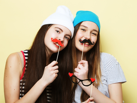 two stylish sexy hipster girls best friends ready for partyの写真素材