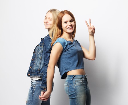 emotions, people, teens and friendship concept - two young teenの写真素材