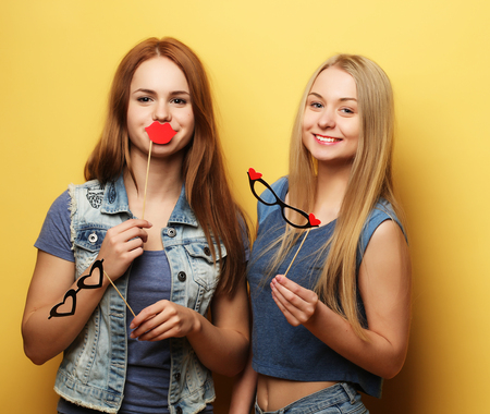 Stylish sexy hipster girls best friends ready for party.Over yeの写真素材