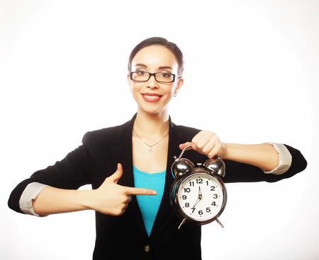 business woman holding in hands big clockの写真素材