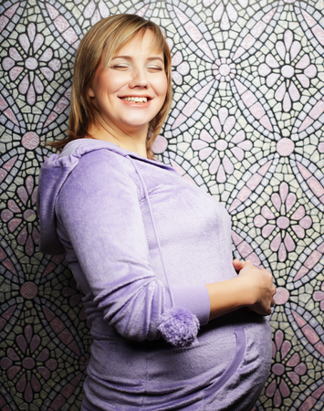 Portrait of the young happy smiling pregnant womanの写真素材