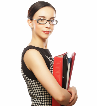 Portrait of smiling business woman with paper folders, isolatedの写真素材