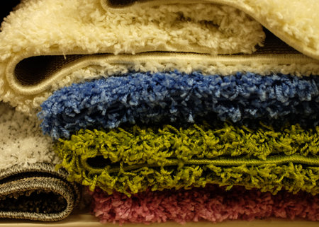 Assortment of different carpets in store. closeup