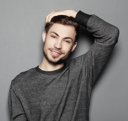 Handsome young man in smart casual wear looking at cameraの写真素材