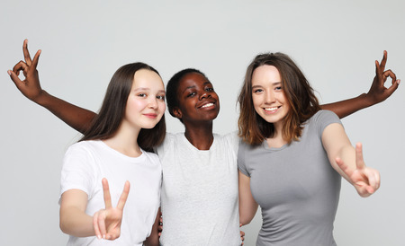 Cheerful European, Asian and African womens.の写真素材