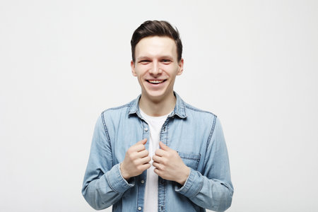 Happy young man over white background