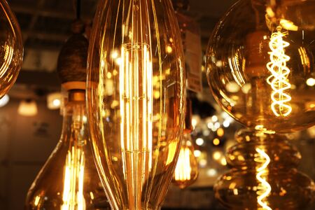 Ceiling lamps on dark background in storeの写真素材