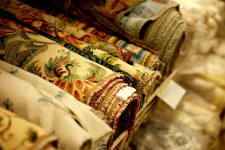Sale - colorful fabrics in the store, close up, shopping conceptの写真素材