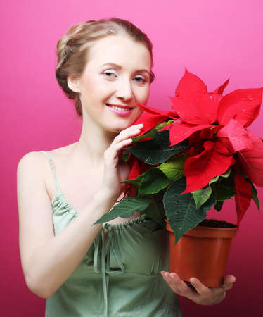 woman with poinsettiaの写真素材