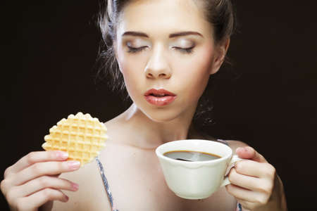 woman with coffee and cookiesの写真素材