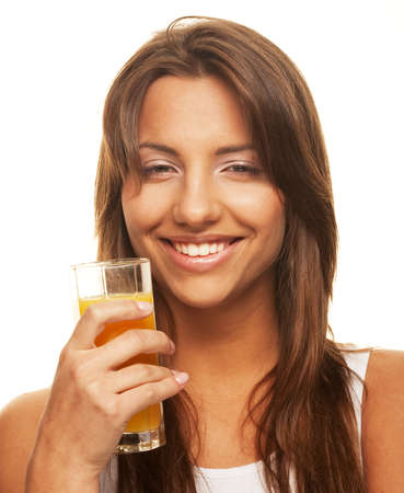 Healthy lifestyle - woman with orange juice on white backgroundの写真素材