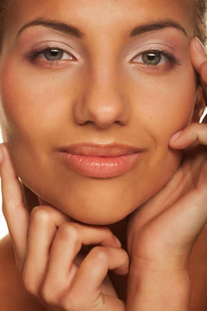 Beautiful woman face - isolated on whiteの写真素材
