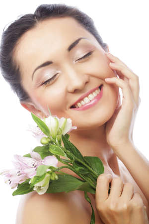 Beautiful asian woman with pink flowersの写真素材