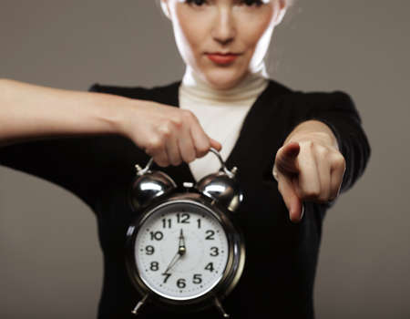 The business woman with an alarm clockの写真素材