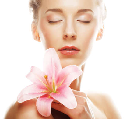 Beauty face of woman with pink lilyの写真素材