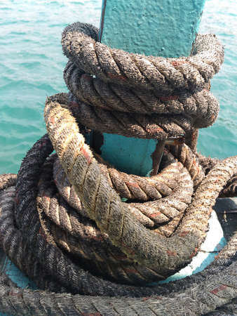 ropes tied on dock sea backgroundの写真素材