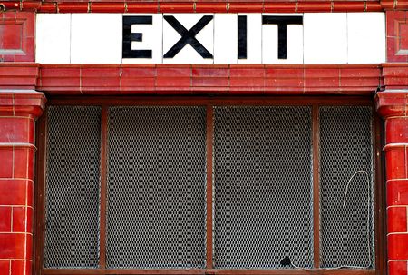 Exit sign from red and white tilesの写真素材