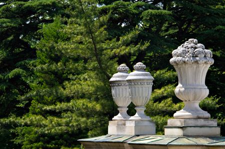 white decoration sculpture with green trees in backgroundの写真素材