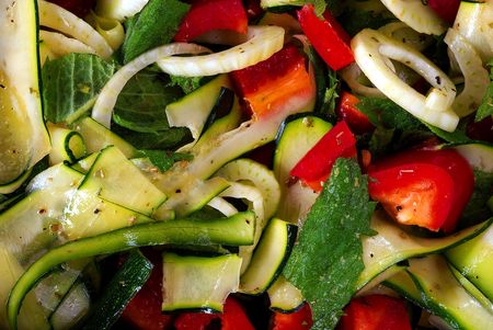 salad from fresh vegetable with olive oil, detail, close upの写真素材