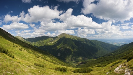 summer mountains scenery with cloudy skyの写真素材